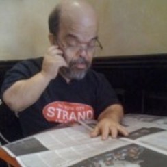 Image of Harry Weider reading a newspaper